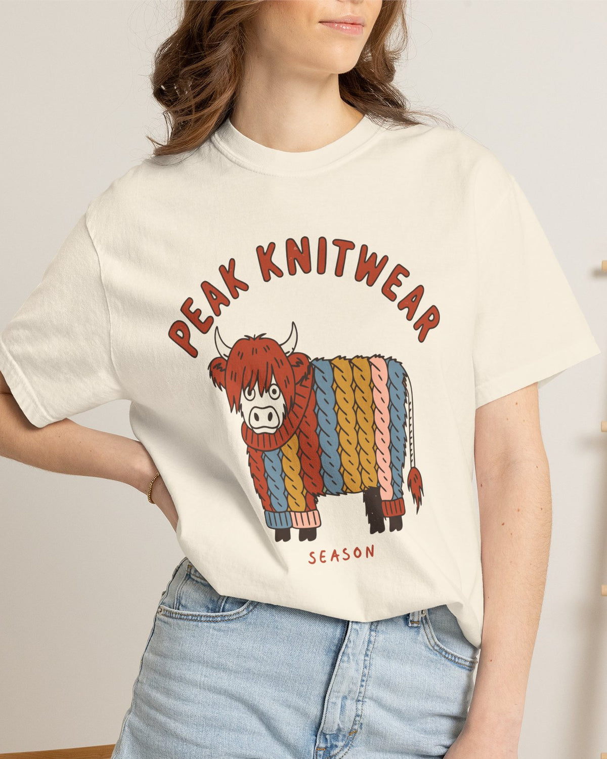 Peak Knitwear Season Highland Cow Tee, worn by a model