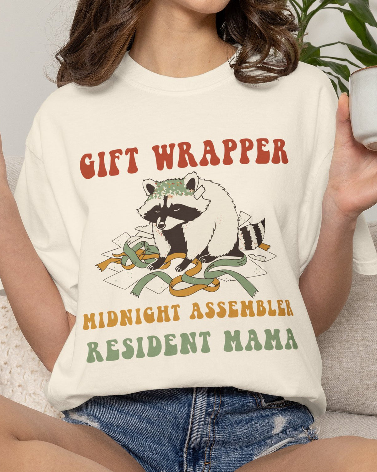 Gift Wrapper Midnight Assembler Resident Mama Shirt, worn by a model