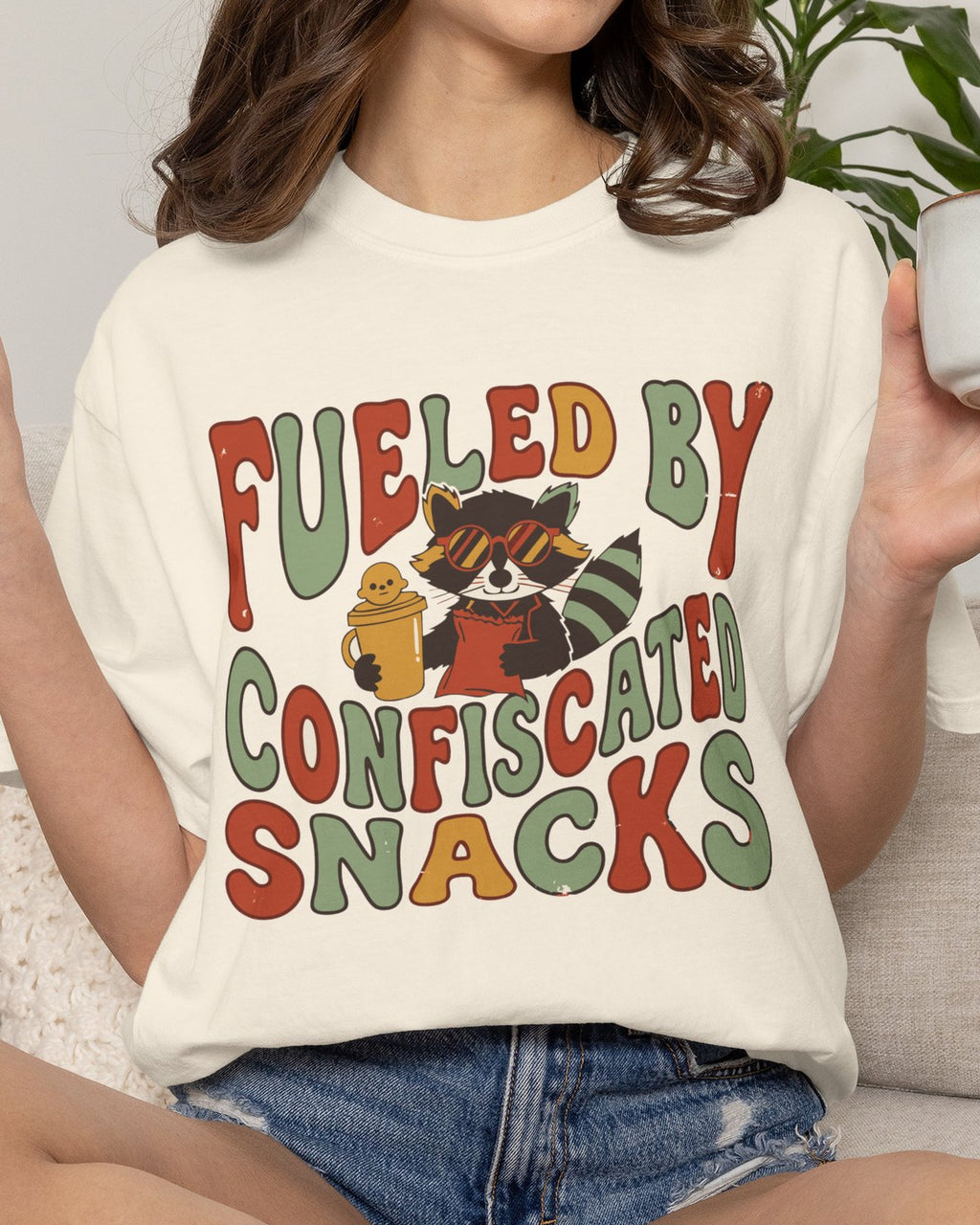 Fueled By Confiscated Snacks Raccoon Mom Shirt, worn by a model