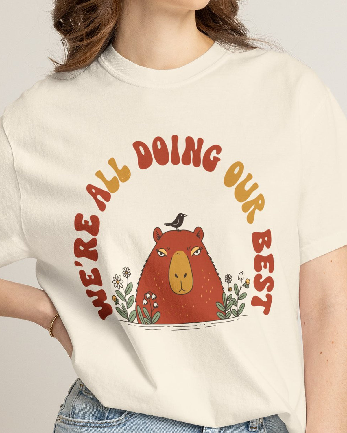 We're All Doing Our Best Capybara Shirt, worn by a model